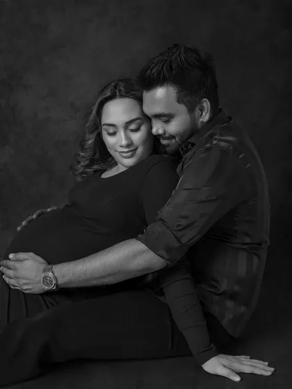 A cozy and intimate seated portrait, where the black and white edit draws all the attention to their connection.