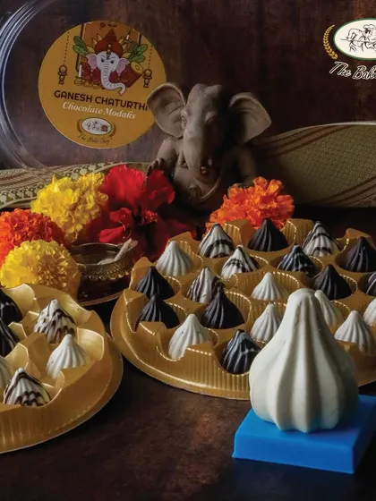 A festive setup for Ganesh Chaturthi, featuring our boxes of assorted chocolate modaks, perfect for offering as prasad.