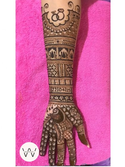 A single arm view of an intricate engagement design, highlighting the beautiful peacock and the engagement ring motif at the top.