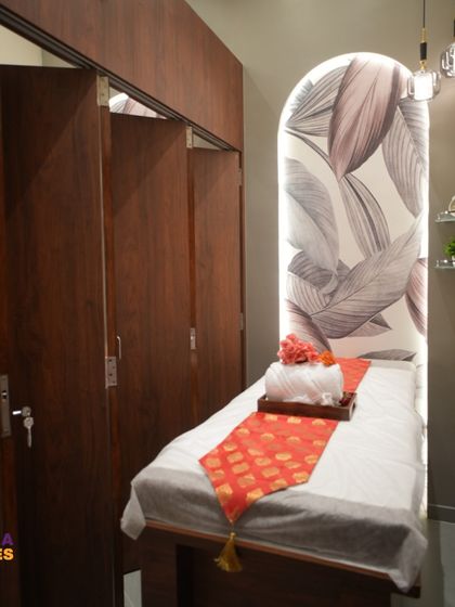 This angle highlights the practical elements of the spa design, including the wooden storage cabinets and foldable partition doors. We ensure every design is not just beautiful but also highly functional for the business operations.