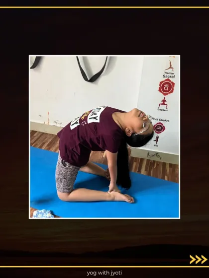 With great concentration, this student holds Ustrasana, a pose that is beneficial for the entire body.