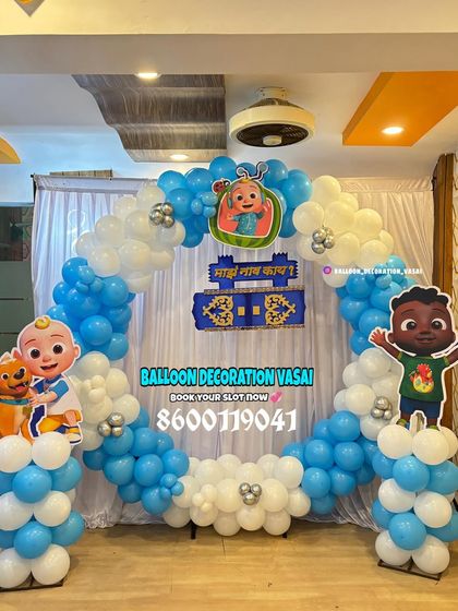 A Cocomelon first birthday with a traditional touch. This ring setup in blue and white includes character cutouts and a custom Marathi banner for the "Barsa" ceremony.