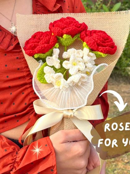 A bouquet for you. This beautiful mix of red roses and white forget-me-nots is wrapped in rustic burlap for a charming and romantic feel.