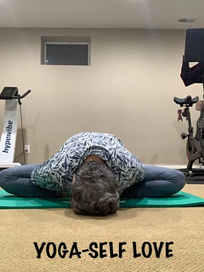 A deep forward fold in bound angle pose, showing how the posture can become restorative and calming.