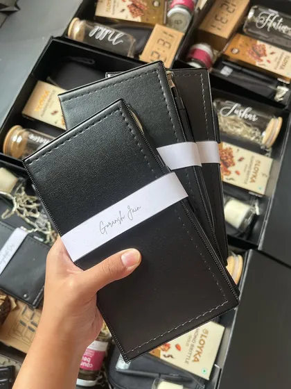A closer look at the personalized notepads included in the Bloomberg anniversary gifts, each with an employee's name, demonstrating our attention to individual detail even in bulk orders.