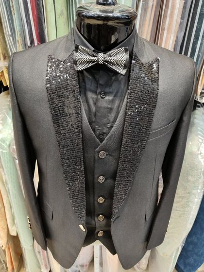 A collection of our designer suits, showcasing a variety of colors, fabrics, and custom details like embroidery, unique lapels, and accessories. Each piece is crafted to make a lasting impression.