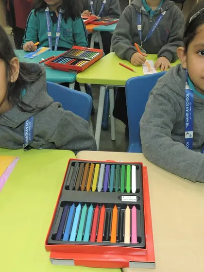 In our classrooms, students work together on activities that promote social values. Here, they are creating art for Disability Day, learning to appreciate diversity.