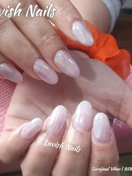A lovely set of almond nails with an iridescent, unicorn-skin finish over a soft pink base.