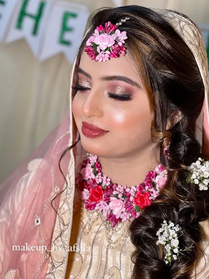 A close-up of her Mehendi makeup. The eyes are shimmery and the lips have a beautiful glossy finish.