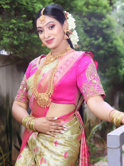 A beautiful three-quarter profile shot, showcasing the contour, highlight, and the way the makeup enhances her features.