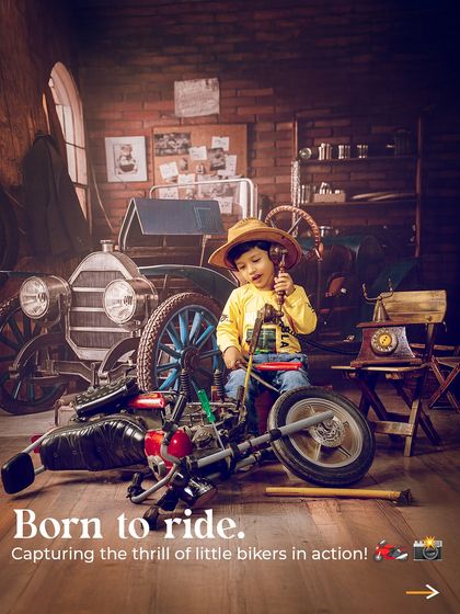 Born to ride, ready to shine. This little biker is captured in action, looking like he's fixing up his motorcycle in our vintage garage.