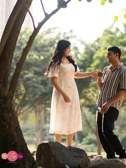 A playful, candid moment in a park. We love capturing the fun and laughter that is such a big part of any love story.