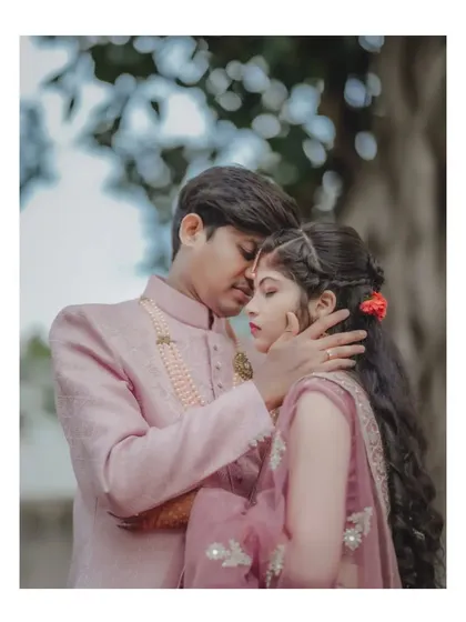 An intimate and romantic portrait of a couple in a soft, natural light setting, perfect for an engagement album.