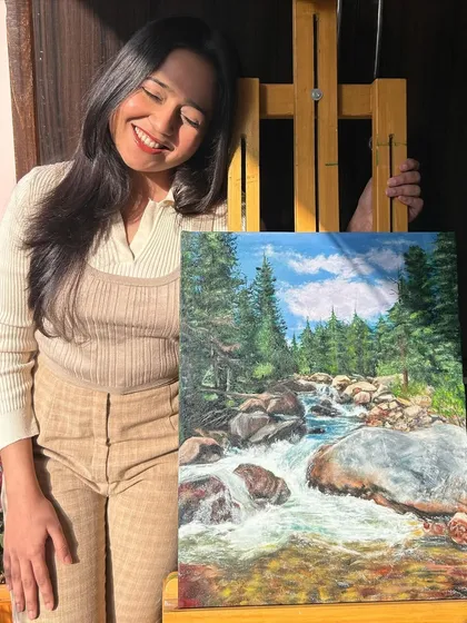 A happy moment with my completed oil painting. I love creating art that brings the serenity of nature indoors.