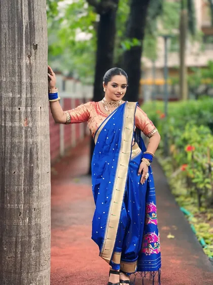 The complete traditional Maharashtrian 'navri' look. I specialize in creating this authentic style, from the nine-yard saree draping to the classic makeup and hair that defines a Maharashtrian bride.