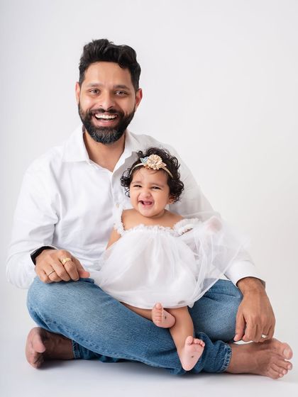 Pure happiness. The shared laughter between this father and daughter is infectious. These are the candid moments that make the most cherished memories.