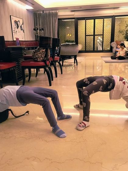 The same students now in a wheel pose. We work progressively on flexibility, ensuring each child develops at their own pace in a safe manner.