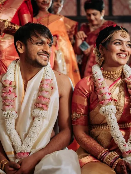 The couple shares a laugh, their happiness evident.