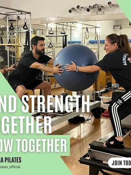 Find strength together, flow together. A great shot of a partner workout, building connection and fitness at the same time.