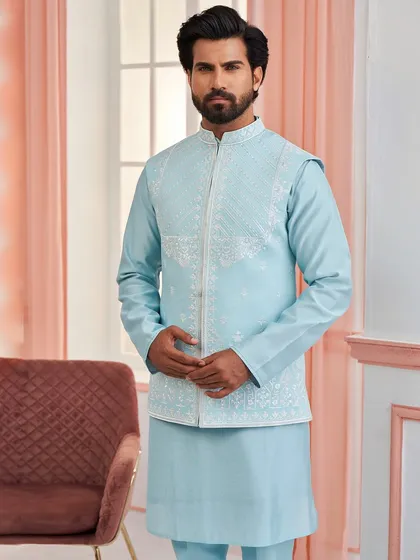 Perfect for day ceremonies, this sky blue kurta set is paired with a jacket featuring intricate white embroidery. The light, refreshing color palette is both elegant and celebratory.