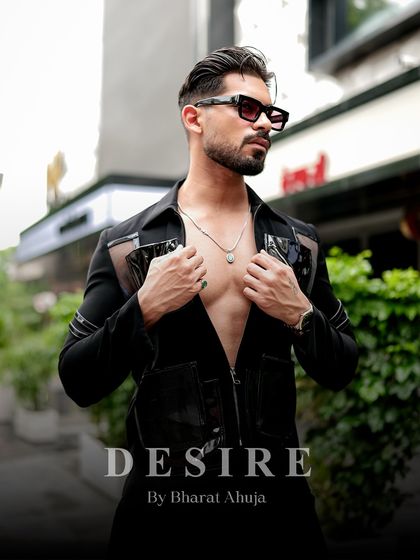 Unleash your desire for bold, unapologetic style. This image captures the powerful and modern aesthetic of the black utility shirt.