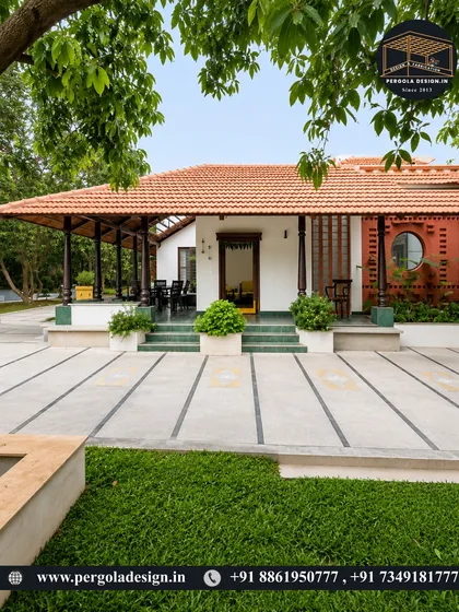 A sprawling traditional home with a long veranda covered by a tiled roof supported by classic pillars. This design creates an expansive, shaded outdoor living space that is both elegant and highly functional.