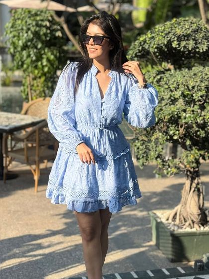 The dress era is back. This blue embroidered dress is perfect for a sunny day, whether you're going for brunch or just running errands.