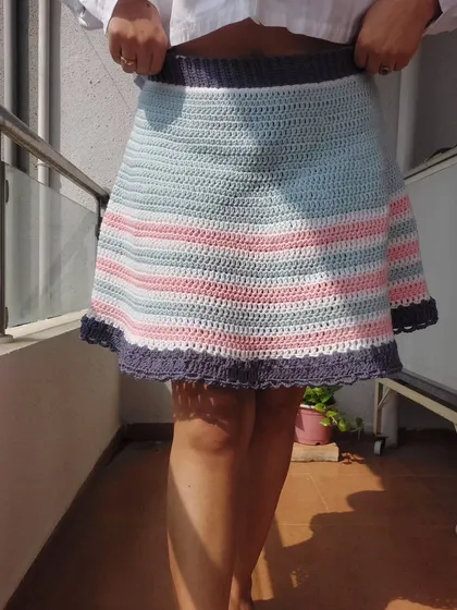A full-length view of the Frilly Billy Skirt, showing its A-line shape and striped pattern.