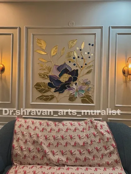 This piece combines 3D piping work with gold foil to create a floral arrangement that has both texture and shine. The art is framed by wall molding, making it look like a built-in masterpiece.