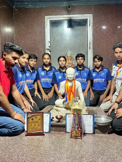 The team seeks blessings after a competition. We believe in hard work, but also in humility and respecting our roots.