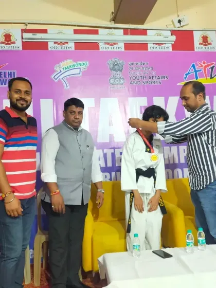 A student receiving his silver medal at the Delhi Taekwondo Sub Jr State Championships. Every medal is a celebration of a student's journey.