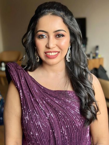 A portrait of the bride, looking radiant and confident. The makeup complements her sparkling gown perfectly.