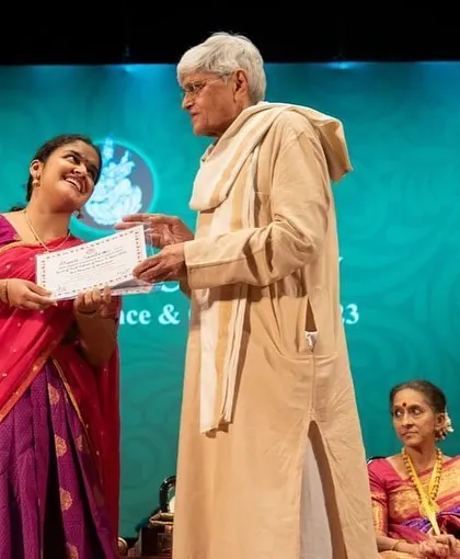 A candid, happy moment while receiving my award at the Music Academy Sadas.