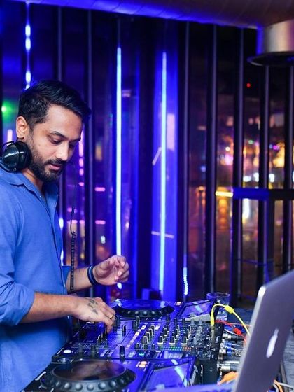 Mixing tracks during my Thursday night Bollywood set at BOHO. I am deeply focused on the technical side of my craft to ensure seamless transitions.