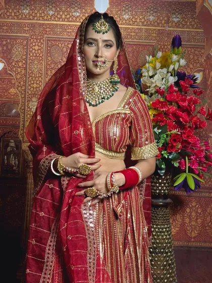 A classic pose in a traditional red gota patti lehenga. This outfit is lightweight yet looks incredibly rich, perfect for a long day of ceremonies.