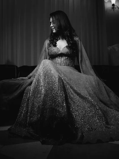 A glamorous black and white portrait of the bride, Simrita, on her cocktail night, looking like a star from a classic film.