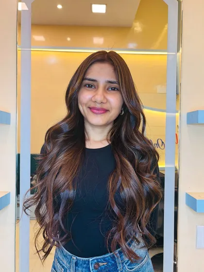 A happy client with her new soft gold and chocolate brown hair. This color combination is incredibly flattering and versatile.