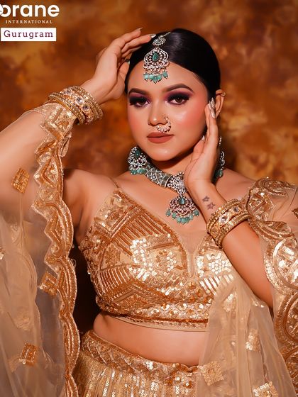 This student portfolio piece showcases a golden glam look with a smokey eye. It's a classic party look that is always in demand.