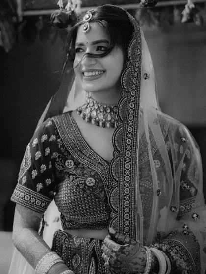 A timeless black and white portrait of a bride's spontaneous, happy smile. This image embodies our love for capturing authentic, candid moments that feel classic and eternal.