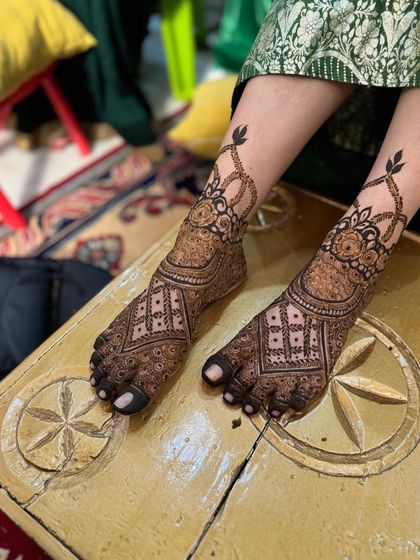 Both feet with the classic bridal design, looking elegant and symmetrical.