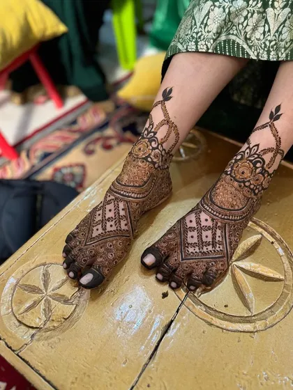 Both feet with the classic bridal design, looking elegant and symmetrical.