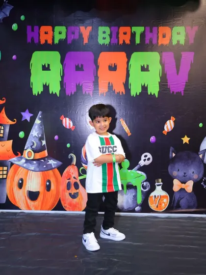 The birthday boy, Aarav, looking cool in front of his spooky-fun Halloween backdrop. It's a great theme for kids who love a little bit of thrill.