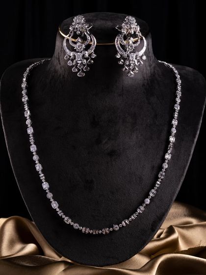 The complete Celeste Radiance set, a diamond-led design for a modern bride. It features a mix of baguette, round, and rose-cut diamonds for a sharp, balanced look.