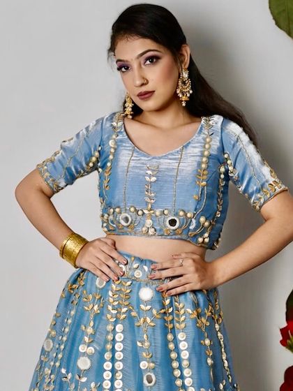 A closer view of the modern lehenga look. You can see the precise application of the purple eyeshadow and the clean, sculpted finish of the base makeup, techniques I focus on in my classes.