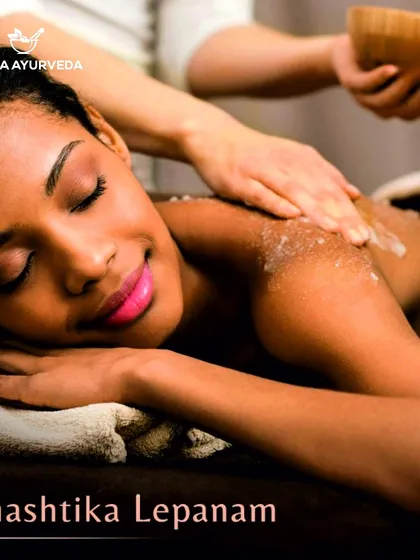 A client enjoying a Shashtika Lepanam treatment, an Ayurvedic therapy that involves applying a paste of cooked rice and herbs to exfoliate and hydrate the skin.