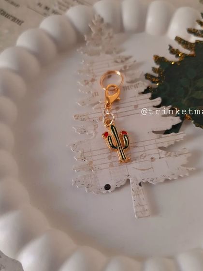 Another look at the fun Christmas cactus charm, a sharp and sweet addition to your festive collection.