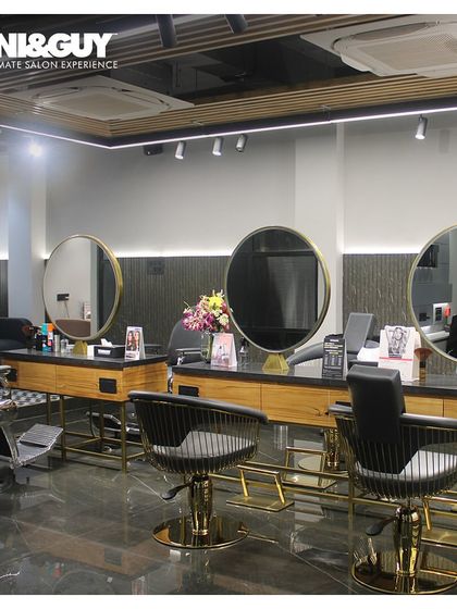 An overview of the cutting floor at our Gomti Nagar, Lucknow location. The space is designed with clean lines and premium finishes, reflecting our commitment to a luxury salon experience.