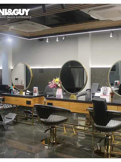 An overview of the cutting floor at our Gomti Nagar, Lucknow location. The space is designed with clean lines and premium finishes, reflecting our commitment to a luxury salon experience.