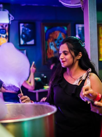 Making fresh cotton candy for the guests. This sweet treat is a signature element of my Ladies' Night experience.