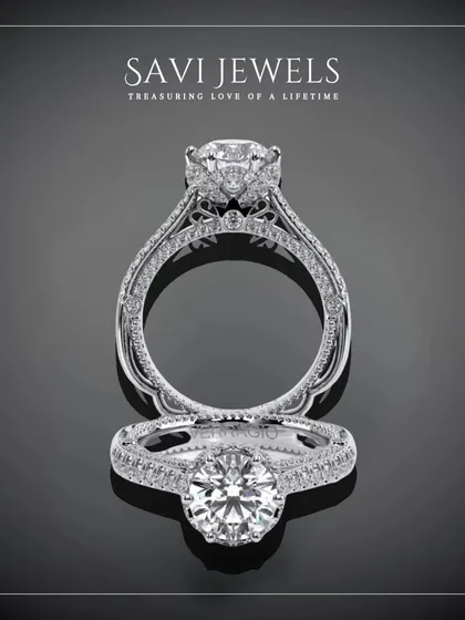 This design is a masterpiece of detail, featuring a central brilliant diamond held within an intricately crafted halo and band. It is a ring designed for a love story that is grand and beautiful.